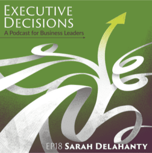 Podcast cover art with a green background. Text reads "EXECUTIVE DECISIONS: A Podcast for Business Leaders. EP18 Sarah Delahanty discussing executive compensation." White abstract shapes and an upward-pointing arrow are also depicted.