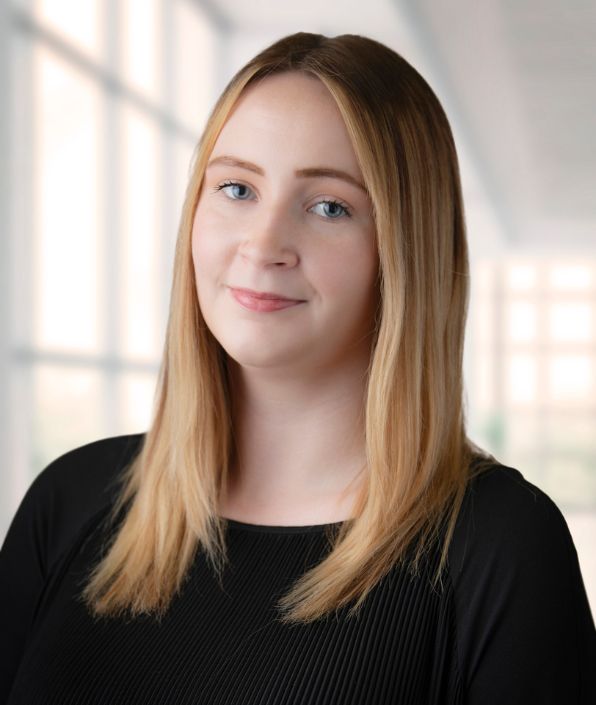 Young woman with blonde hair in a black shirt