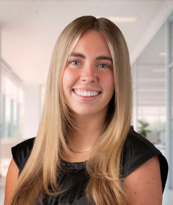 a young woman with long blond hair sitting