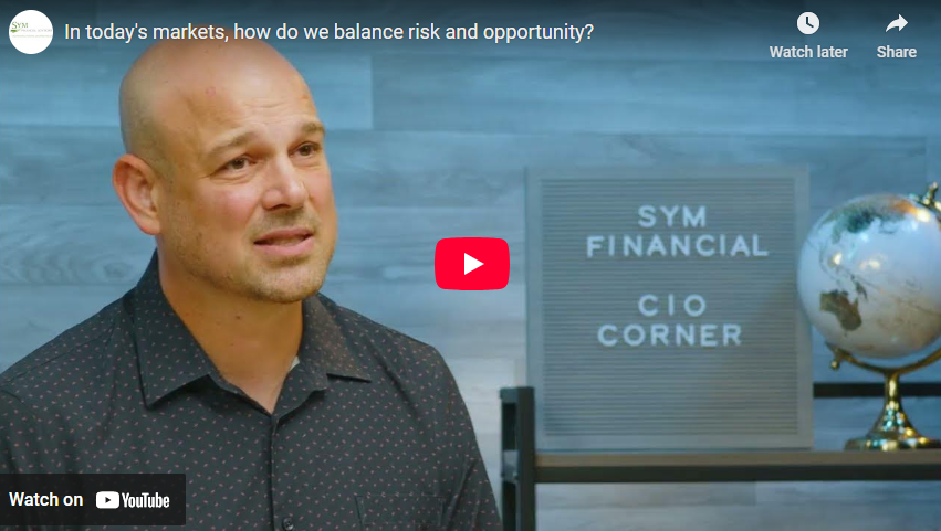 video tile of SYM Chief Investment Officer, a bald man with button down shirt, speaking in front of a blue wall