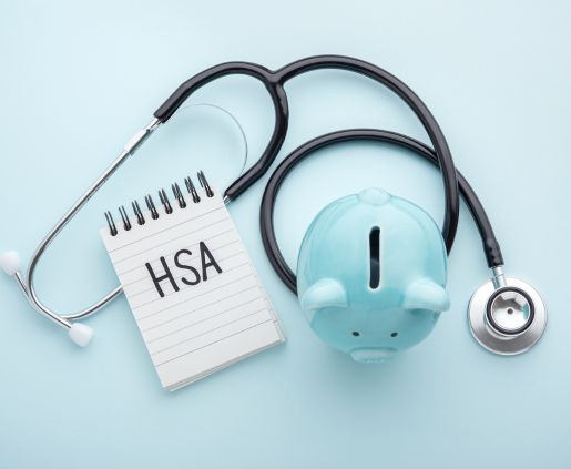 blue piggybank with a notepad that reads HSA