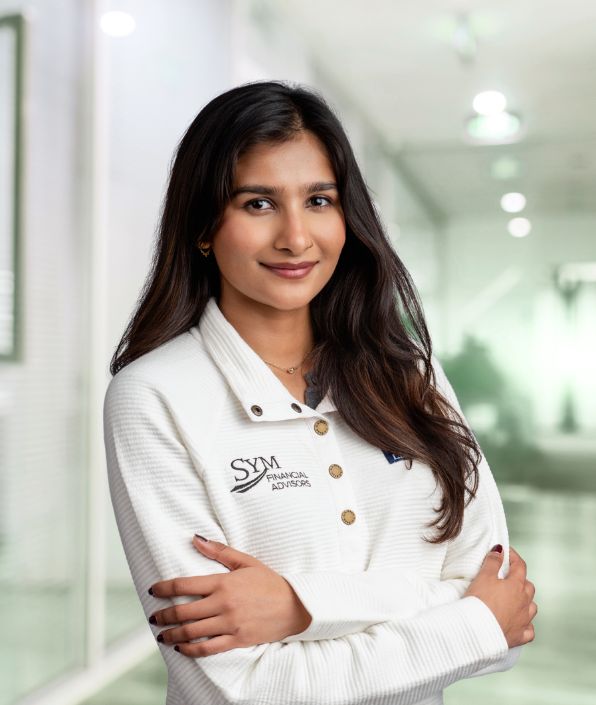 a woman with long dark hair wearing a white shirt
