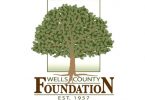 A green tree with the words under it: Wells County Community Foundation
